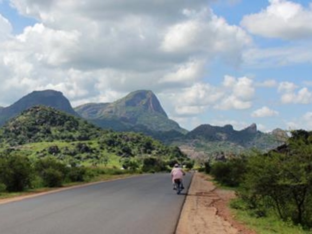 Person on bike in African mountains